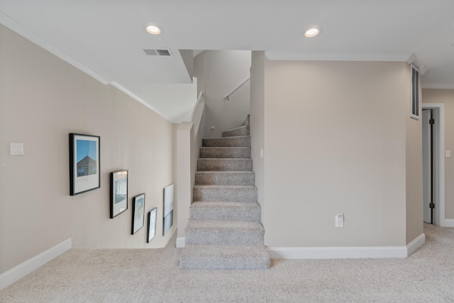 stairs featuring light colored carpet and crown molding