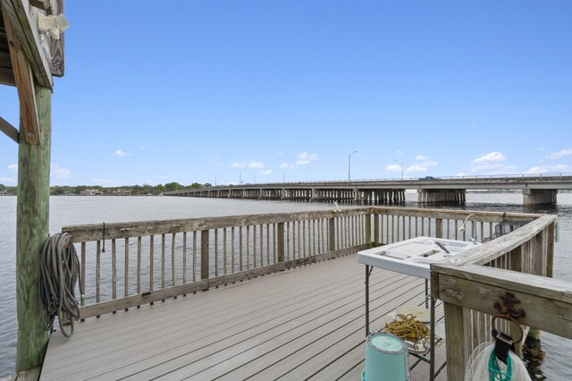 wooden terrace with a water view