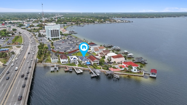 birds eye view of property with a water view