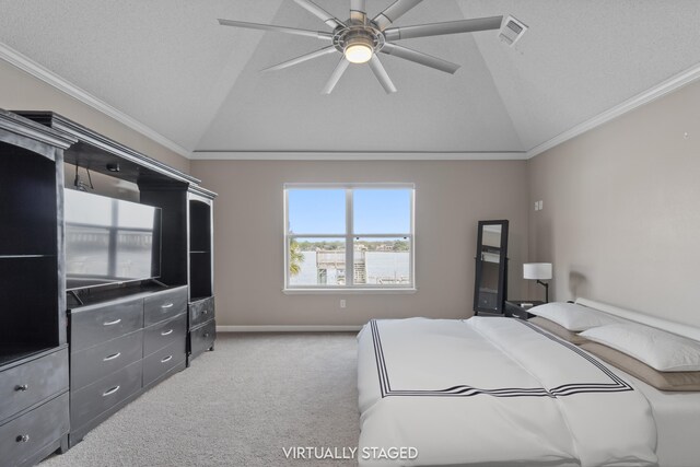 bedroom with ceiling fan, vaulted ceiling, light carpet, and ornamental molding