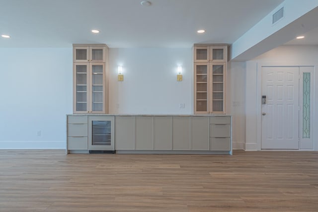 interior space featuring wine cooler and light wood-type flooring