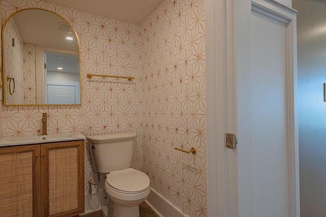 bathroom with oversized vanity, tile walls, and toilet