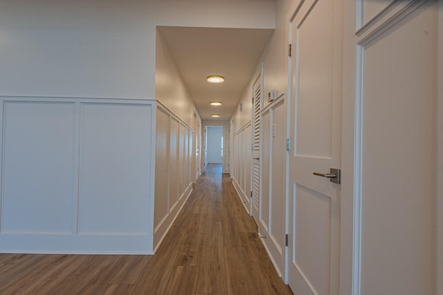 corridor with dark wood-type flooring