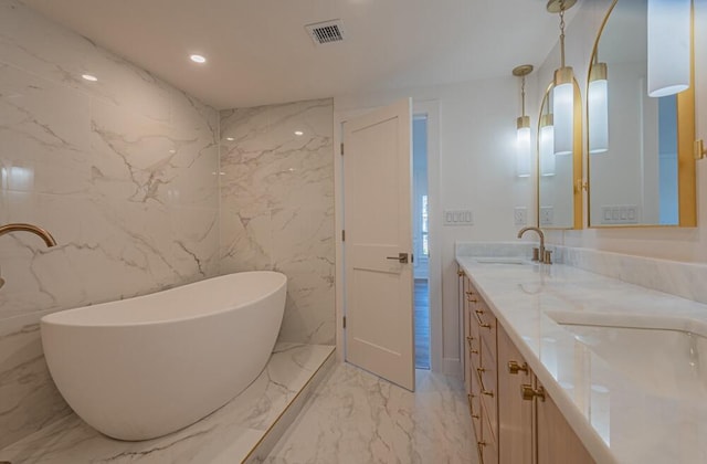 bathroom with tile walls, large vanity, a bathing tub, tile flooring, and double sink