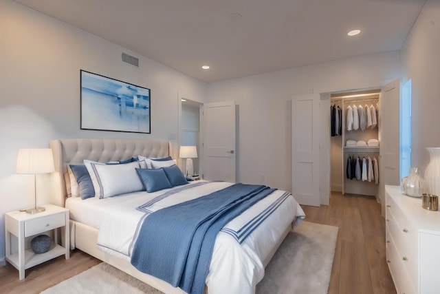 bedroom featuring a closet and light wood-type flooring