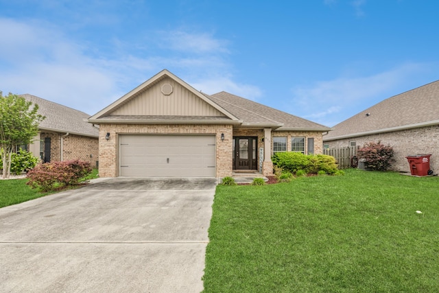 view of front of home with a garage and a front lawn