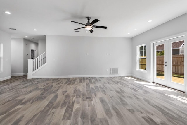 spare room featuring french doors, hardwood / wood-style flooring, and ceiling fan