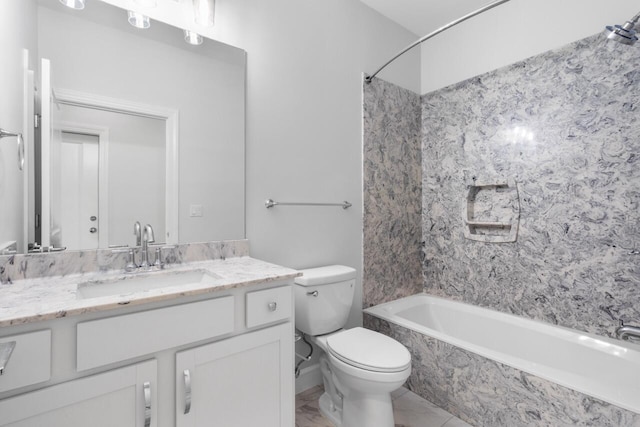 full bathroom with vanity, toilet, and tiled shower / bath combo