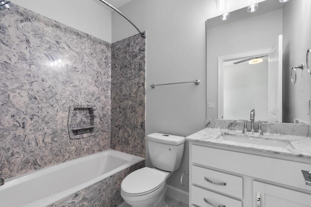 full bathroom featuring tiled shower / bath, toilet, and vanity