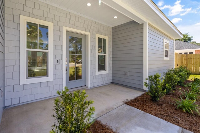 property entrance with a patio