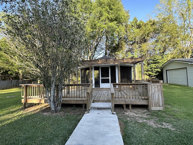 view of front of property featuring a deck, a sunroom, and a front lawn