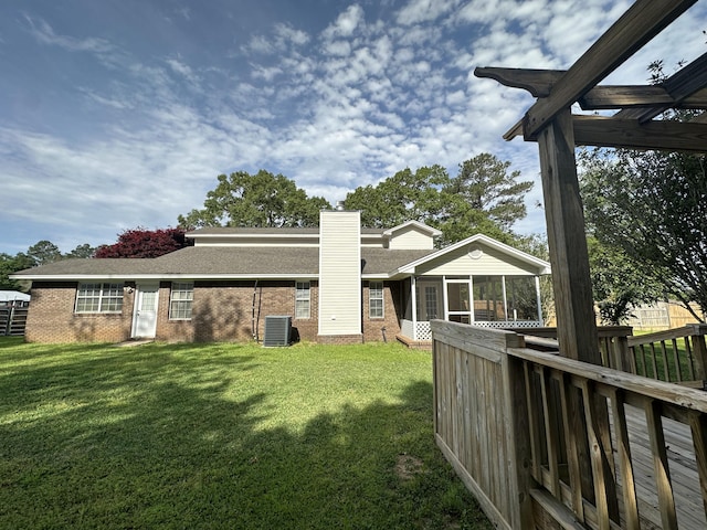 view of yard featuring central AC and a pergola