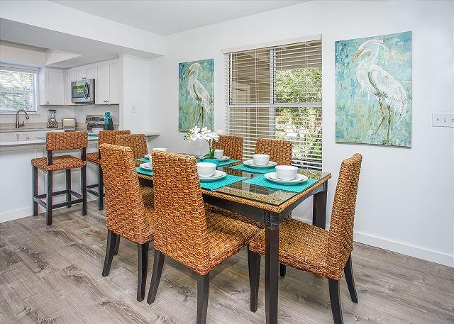 dining space with light hardwood / wood-style floors