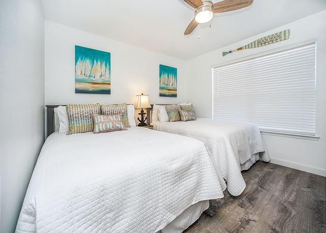 bedroom with ceiling fan and dark wood-type flooring