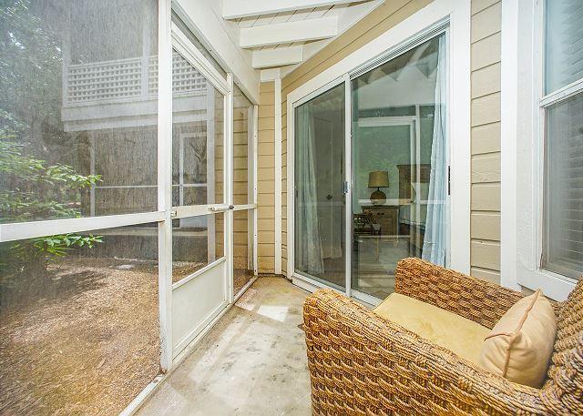 unfurnished sunroom featuring beam ceiling