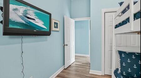 hallway featuring wood-type flooring