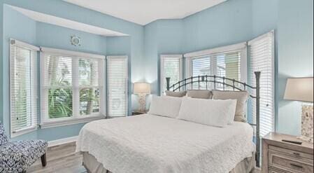 bedroom with hardwood / wood-style flooring