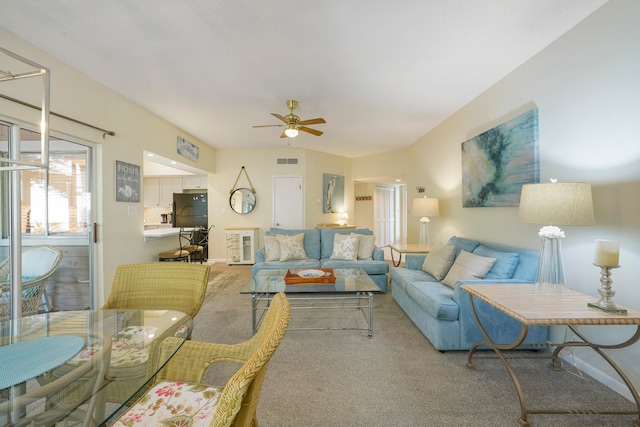 living room with carpet floors and ceiling fan