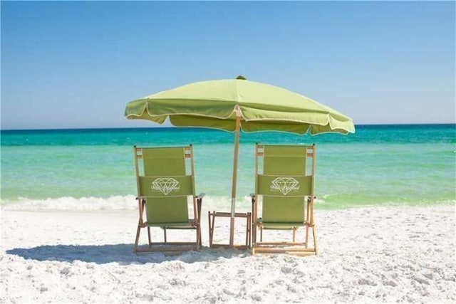 property view of water featuring a beach view