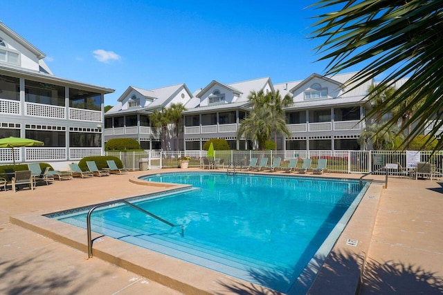 view of swimming pool with a patio