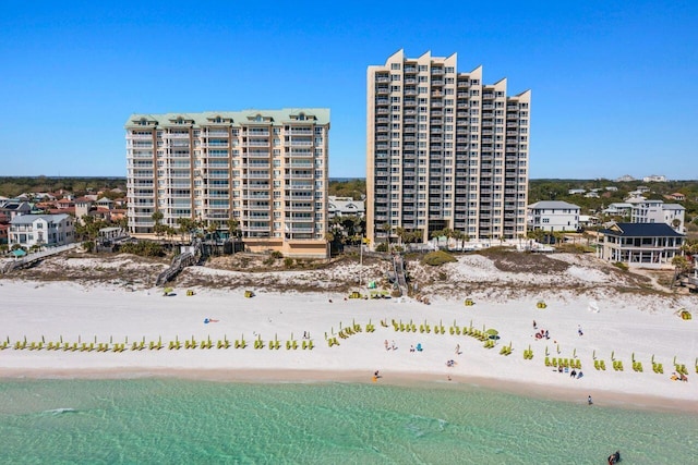 view of building exterior featuring a beach view