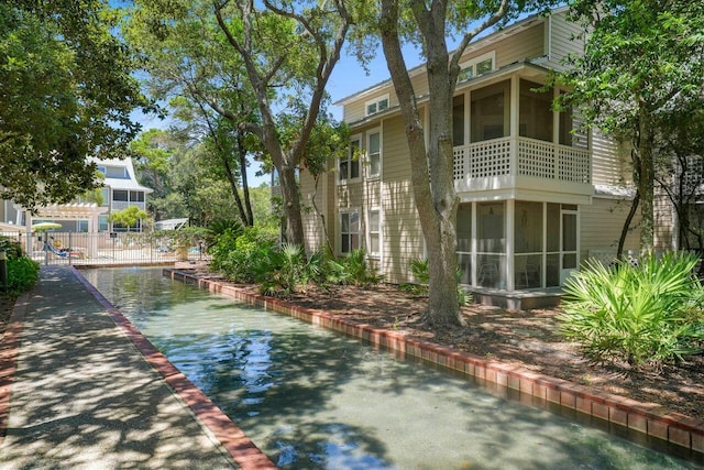 view of side of home with a balcony