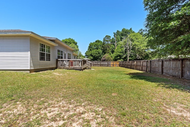 view of yard featuring a wooden deck