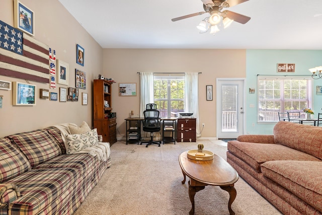 living room with ceiling fan and carpet flooring