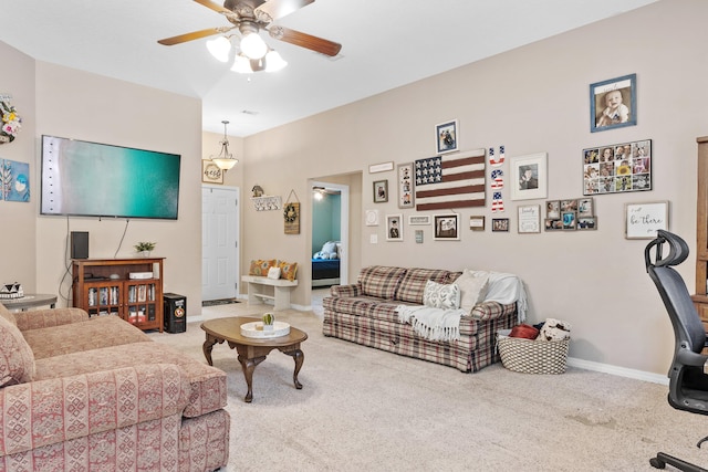 living room featuring ceiling fan and carpet