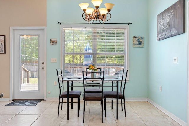 dining room with a notable chandelier and light tile flooring