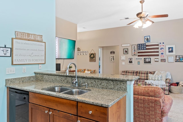 kitchen with ceiling fan, sink, dishwasher, carpet floors, and light stone countertops