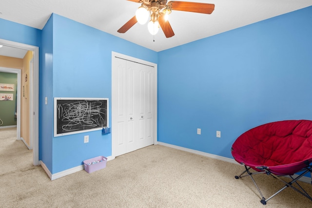 unfurnished room with ceiling fan and carpet floors