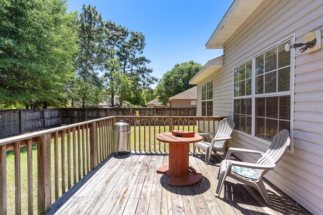 wooden terrace with a yard