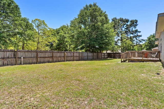 view of yard with a wooden deck