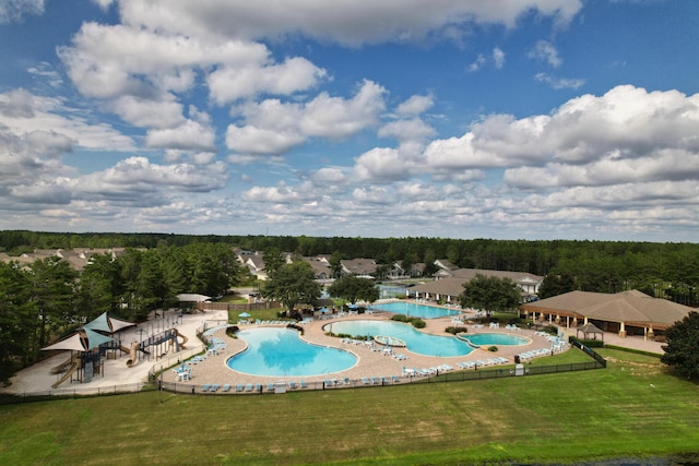 view of pool with a yard and a patio area