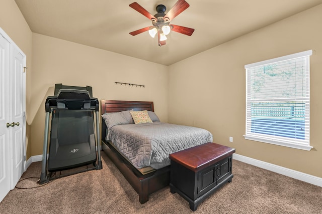 carpeted bedroom featuring ceiling fan