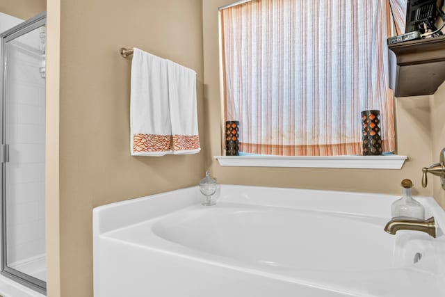 bathroom with a bath to relax in