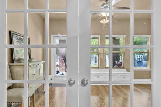 interior space featuring light hardwood / wood-style floors and ceiling fan