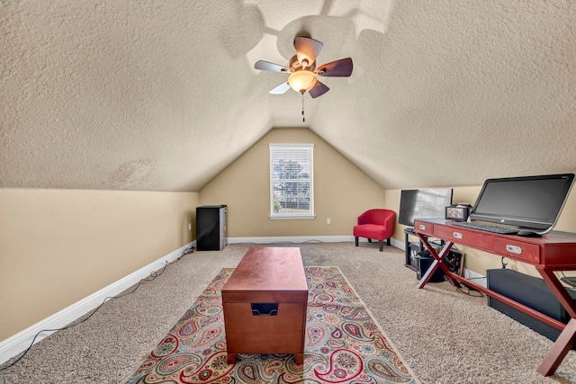 interior space with a textured ceiling, ceiling fan, and vaulted ceiling