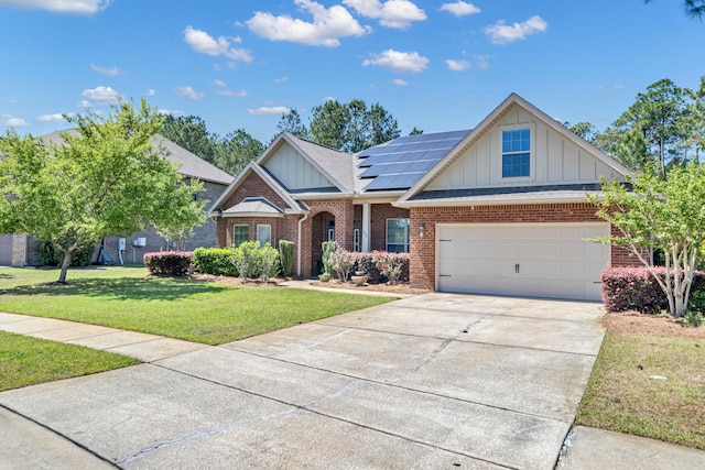 craftsman-style home with solar panels, a garage, and a front lawn