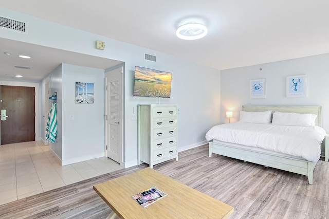 bedroom with tile floors