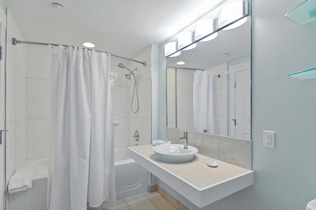 bathroom featuring shower / tub combo, tile floors, and sink