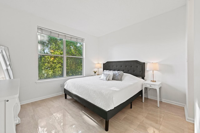 tiled bedroom with multiple windows