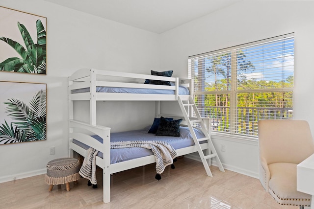 bedroom featuring light tile floors