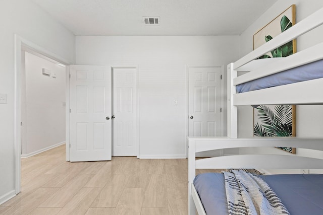 bedroom with light wood-type flooring