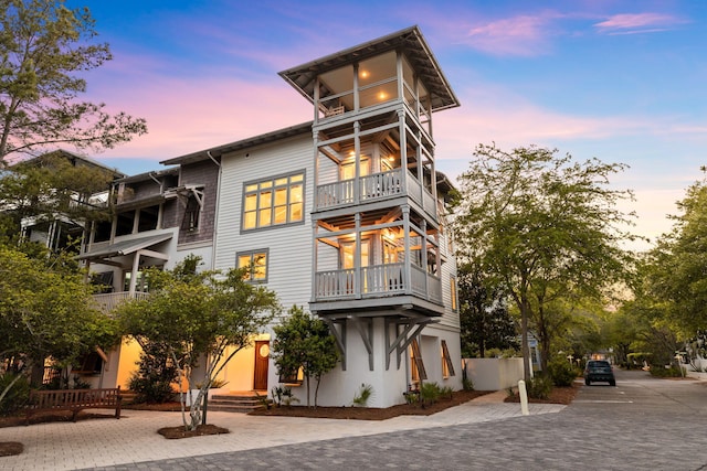 view of outdoor building at dusk