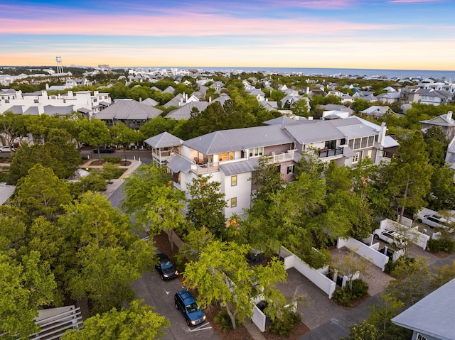 aerial view at dusk with a water view