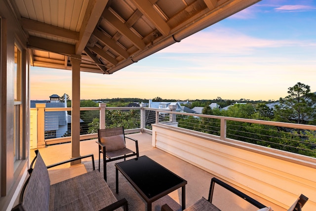 view of balcony at dusk