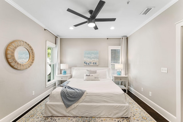 bedroom with ceiling fan, crown molding, and dark wood-type flooring