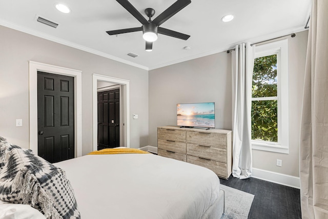 bedroom with ceiling fan, crown molding, dark wood-type flooring, and multiple windows